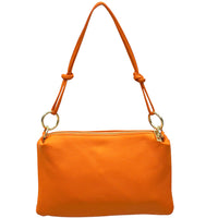 Orange handbag with a strap on a white background